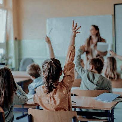 Teacher conducting a group class in a traditional classroom, highlighting the need for personalized learning for students in Indore